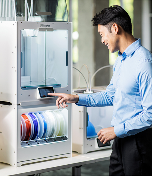 Man standing in front of 3D printer